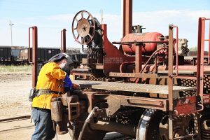 A Cathcart Rail employee working on a railcar A Cathcart Rail employee working on a railcar
